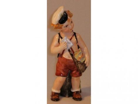 An Italian pottery figure of 'love letter post boy'