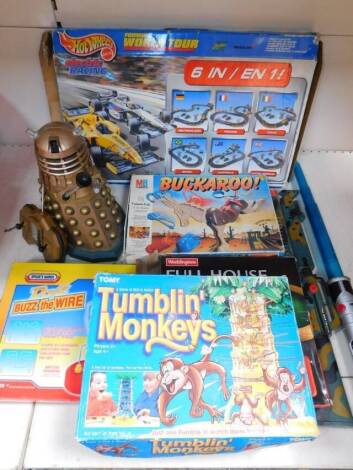 Toys and games etc., including a battery powered Dalek, 40MHZ, 32cm high, a Waddingtons Full House, various other games, Hot Wheels set, Buzz the Wire, Tumblin Monkeys, light saber etc. (quantity).