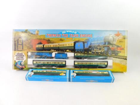 A Hornby OO gauge Thomas The Tank Engine Gordon Passenger electric train set, R137, together with an Express composite coach, R120, and brake coach, R121, all boxed. (3)