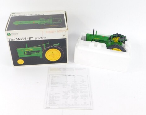 An Ertl Collectibles Precision Classics diecast model of a Model B tractor, number 12 for John Deere, number 5107, scale 1/16, boxed.