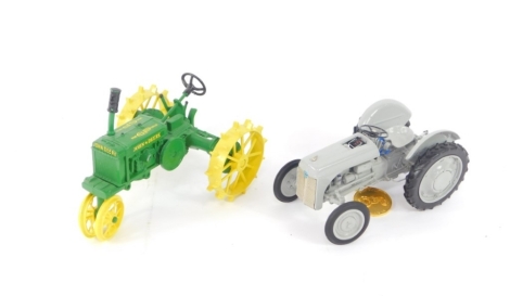 An Ertl Precision Models diecast model of a John Deere wide general purpose tread tractor, scale 1/16, number 0576, together with a model of 1939 Ford early 9N tractor, scale 1/16, with medallion. (2)