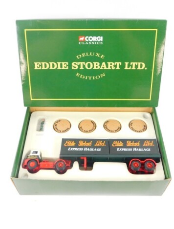 A Corgi classics Eddie Stobart diecast model of a Foden S21 arctic trailer, limited deluxe edition, with containers, white metal figures and additional load on wooden plinth, number 14302, boxed.