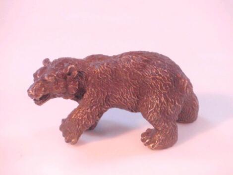 An early 20thC bronze model of a bear