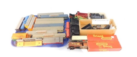 Triang OO-gauge coaches, including two double decker coaches, goods and flat bed wagons, tankers, together with locomotive and tender parts. (a quantity)