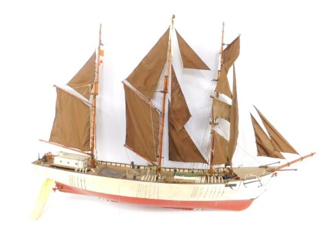 A remote control barquentine 'Cymru', modelled with a wooden hull, twin screw propeller and with fully rigged triple masts, with figures, 143cm wide, 103cm high.