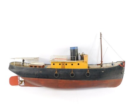 A remote control model of a Norwegian fishing boat, with figures, 146cm wide, 28cm deep.