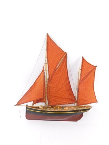 A wooden scale model of a Thames Barge, oval plate to the stern marked Hanah, 59.5cm wide.