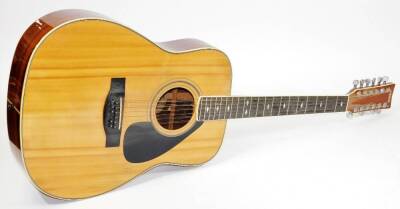 A Yamaha FG612S 12 string acoustic guitar, having bound front and rear, with diamond shaped inlaid fret markers.