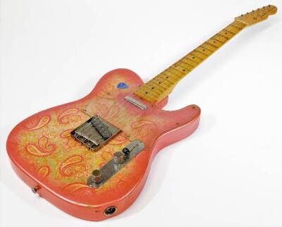 A Fender Telecaster made in Japan paisley model electric guitar, having two single coil pickups with maple neck, worn gold coloured tuners. (AF)