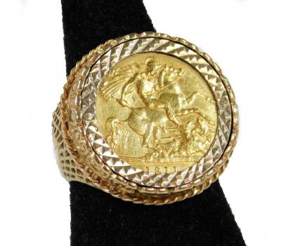 An Edwardian gold full sovereign 1911, in basket weave ring setting, size R, 12g all in.