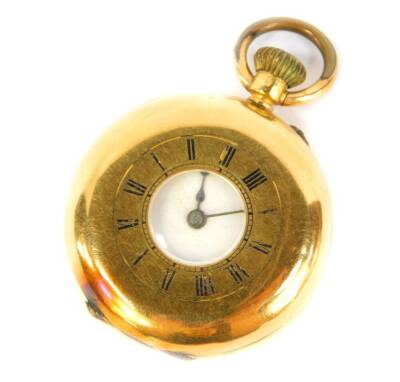 A late 19thC ladies half hunter pocket watch, bezel wind, in a yellow metal case stamped 18K.