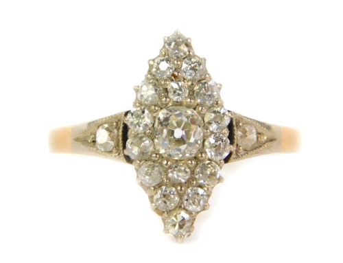 An 18ct gold diamond marquise cluster ring, set with old cut stones to the shoulders and mount, 3.1g all in.