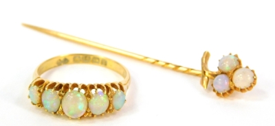 An 18ct gold dress ring set with five graduated opals, Birmingham assay, 3.3g all in and a stick pin set with three opals (2).