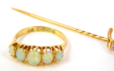An 18ct gold dress ring set with five graduated opals, Birmingham assay, 3.3g all in and a stick pin set with three opals (2). - 2