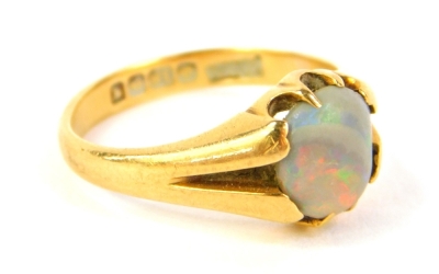 An 18ct gold dress ring, set with a single opal, Birmingham assay, 3.7g all in. - 2