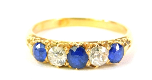 A sapphire and diamond five stone ring, set in unmarked yellow metal, 3.7g all in.