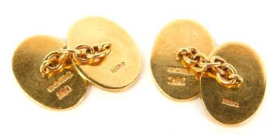 A pair of 9ct gold oval cufflinks, with engine turned decoration, 12.7g. - 2