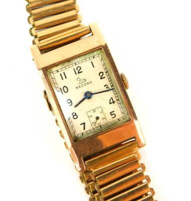 A 9ct rose gold Record Art Deco tank design gentleman's wristwatch with Swiss 15 jewel movement, London 1946, on a rolled gold gate bracelet.