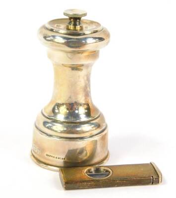 A silver pepper mill by Mappin & Webb, Birmingham assay and a silver cigar cutter (2).