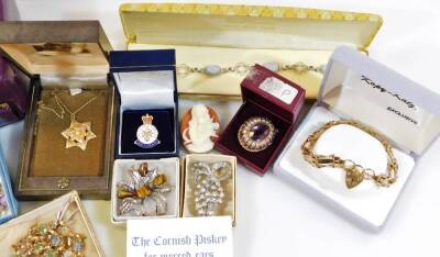 Various costume jewellery and effects, a costume brooch of shaped floral form with plain pin back, 5cm wide, a gold plated gate bracelet, various other costume jewellery, the Fell Cup Final Umpire medallion 1996, various other costume brooches, gold fille - 2