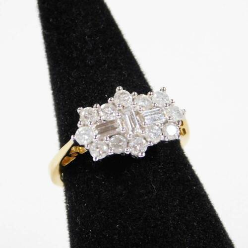 A floral set dress ring, with baguette cut white stones, surrounded by small claw set stones, on a partially pierced shank marked 18K, size N, approx 4.8g all in.