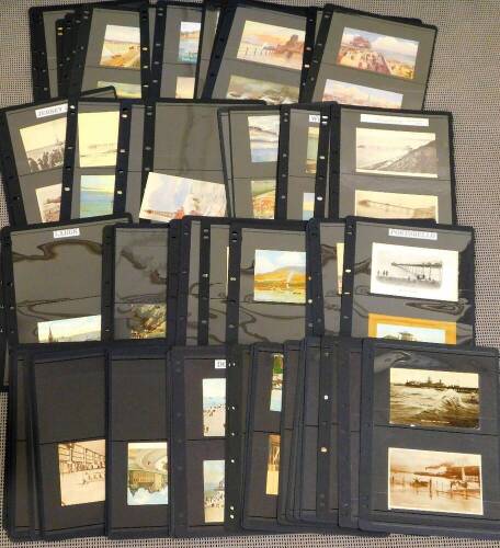 Various postcards, early 20thC seascapes, seaside towns etc., black and white printed scenes, etc., to include When Waves Meet New Brighton, Boating At New Brighton, various others, Egremont Pier, North Pier Blackpool with many figures, various other Bla