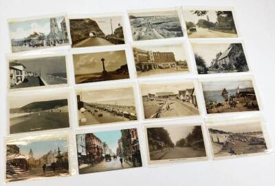 Various postcards, early 20thC townscape, black and white and others to include Cumbria, Square Kirby Lonsdale, central station, seaside towns, Howth, Cathedral Cliffs, Country Antrim, Dartmouth Butterwalk, other street scenes, etc. (a quantity) - 3