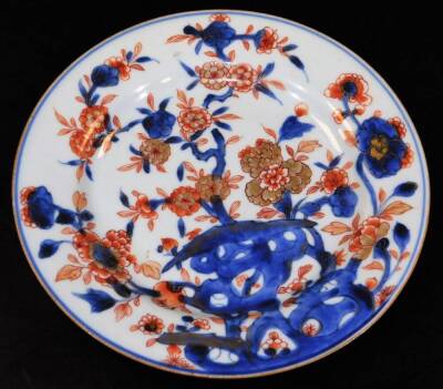 A Japanese Meiji period Imari plate, of octagonal form decorated with a repeat floral pattern, predominately in orange and blue, 23cm wide and three other Imari design plates. (a quantity) - 2