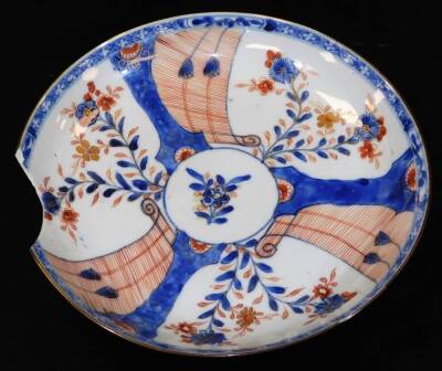 A Japanese Meiji period Imari plate, of octagonal form decorated with a repeat floral pattern, predominately in orange and blue, 23cm wide and three other Imari design plates. (a quantity) - 9