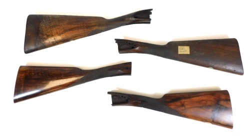 Four various walnut shotgun stocks, 41cm wide. (a quantity)