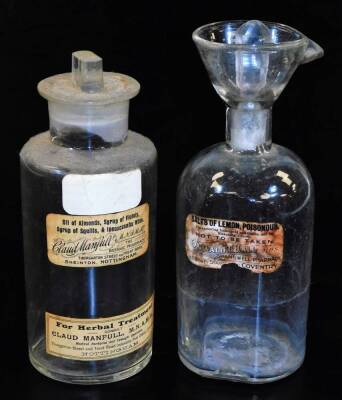 Various pharmaceutical bottles, Salts of Lemon and a further jar Claud Manfull partially labelled with stopper, 22cm high. (2)