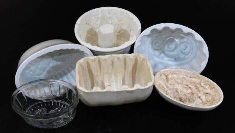 Various 19thC and other pottery jelly moulds, to include one of oval form with berry design, 15cm wide, glass example, other pottery examples, etc. (6)