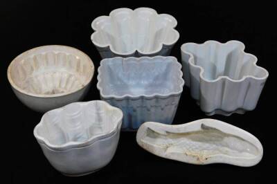 Various late 19thC and early 20thC pottery jelly moulds, to include one of shaped circular form with floral centre, a diamond shaped example set with flowers, another with seahorse, 15cm wide. (6)