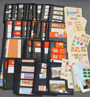 Various stamps and philately, Queen Elizabeth II stamp sets, Royal Mail stamps five at 20p, £1 to include Wicken Fen, Click Mill, various first class stamp booklets, repeat 25p stamps, unused, various other £2 Royal Mail stamps, a large quantity of others