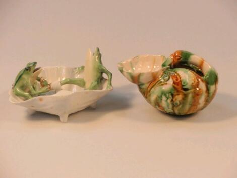 A Continental porcelain numerous group of two frogs in a shell