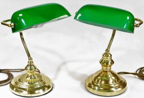 A matched pair of desk lights, each with articulated green shades on shaped stems and stepped circular bases, with modern electrical features, 38cm high. (2)