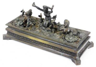 After the Antique. An early 19thC Grand Tour bronze inkstand, having a central figure of a sea goddess on a rock enclosed by two part submersed mermaids with cornucopia, on a stepped guilloche base, 39cm wide, 18cm deep, 19cm high.