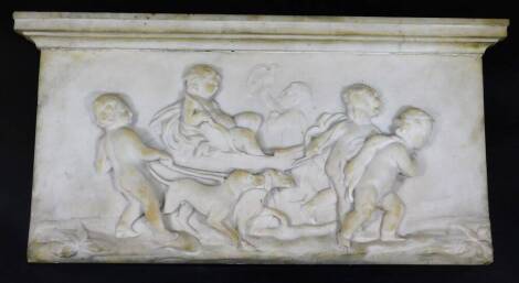 A 18thC Grand Tour heavily carved neo-classical marble frieze, of rectangular form with fixed carved cornice top, the main body raised with various cherubs and putti, one in a sleigh, others with dogs and birds, on a naturalistic base, unsigned, 26cm high