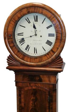 An early Victorian flame mahogany tavern type drop dial wall clock, with circular bezel and moulded insert hood, full length trunk door, crossbanded and arch topped, the 36cm diameter circular painted dial having Roman hour numerals, subsidiary second rin