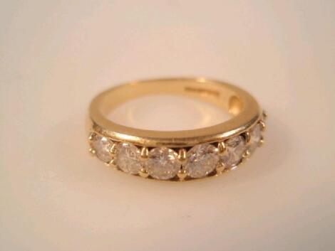 An 18ct gold seven stone inline diamond ring
