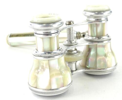 A pair of mother of pearl and chrome plated opera glasses, with side handles, stamped Belere Paris.