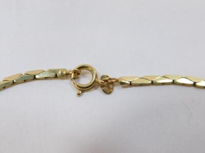 A 9ct gold fancy link neckchain, with a fringe of graduated triple interlinked ovals, on a bolt ring clasp, 12.6g. - 2