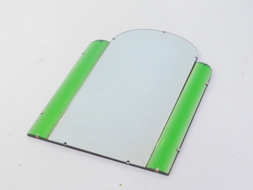 An Art Deco clear and green glass wall mirror, of winged, domed form, inset level glass 51cm wide, 72cm high.