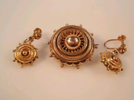 A circular Victorian memorial brooch