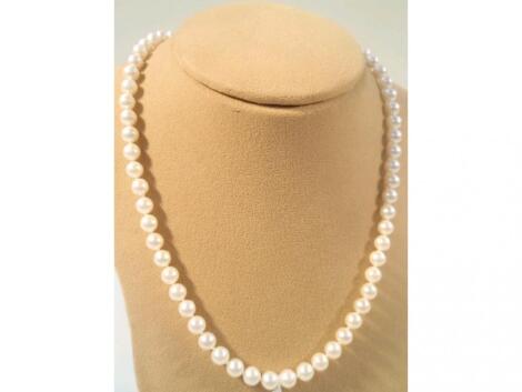 A string of pearls, each 6mm approx, sixty four approx total, 44cm, with
