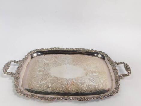 A Walter Trickett silver plated twin handled tray, with engraved foliate decoration within a gadrooned foliate scroll border, 70.5cm W, 42cm D.