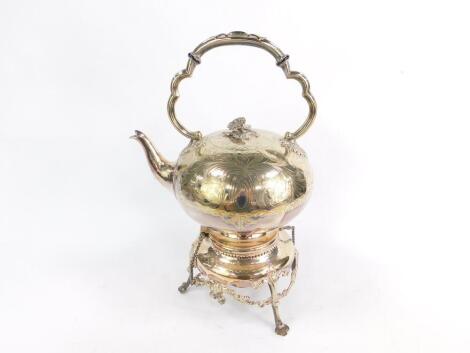 A Victorian silver plated tea kettle on stand, with burner, with engraved floral and foliate decoration, raised on three trefoil feet, 42cm high.