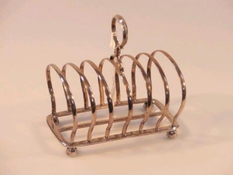 A George V silver seven bar toast rack by William Hutton