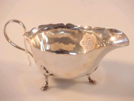 George VI silver sauce boat by Mappin & Webb on three stylized hoofed feet