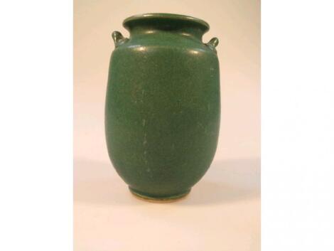 An Art pottery green ground stoneware vase